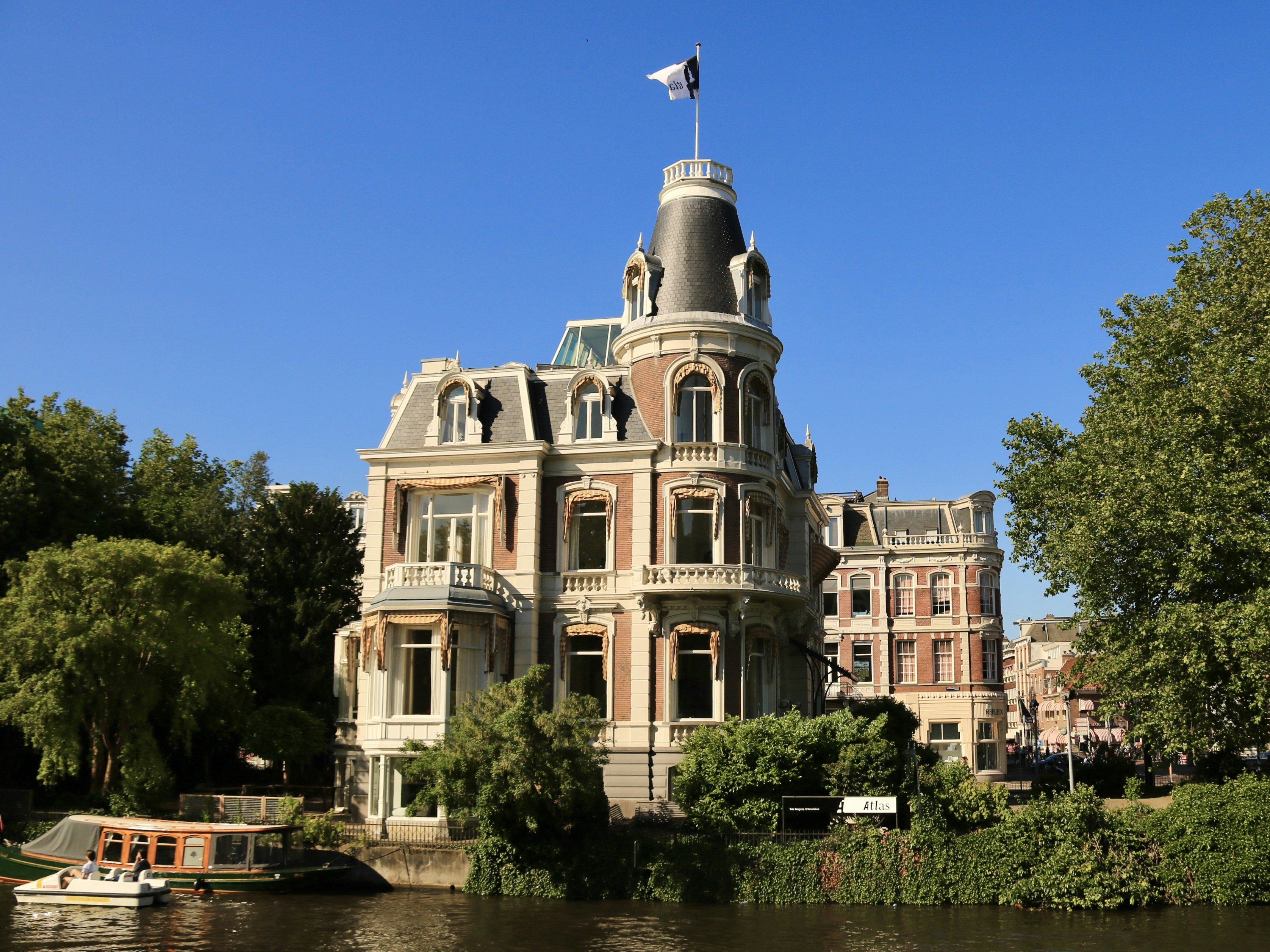 a large building sitting next to a body of water