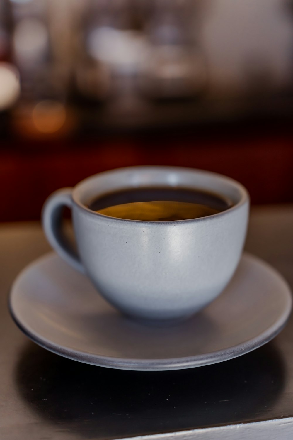 a cup of coffee sitting on top of a saucer