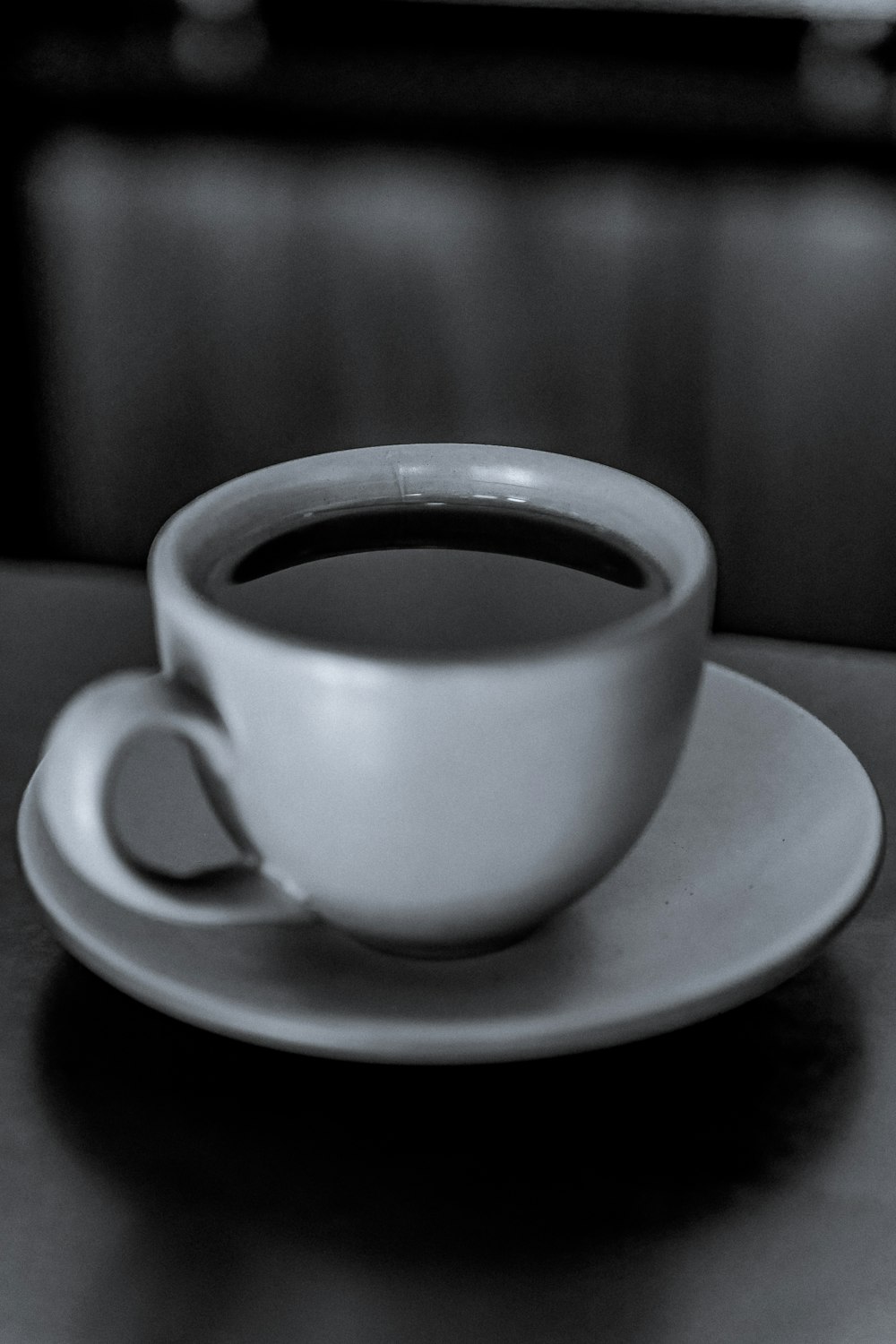 a cup of coffee sitting on top of a saucer