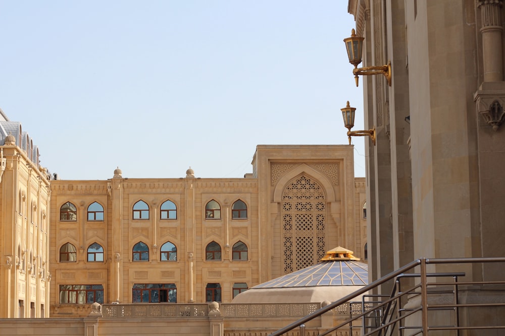 a large building with many windows and a staircase leading up to it