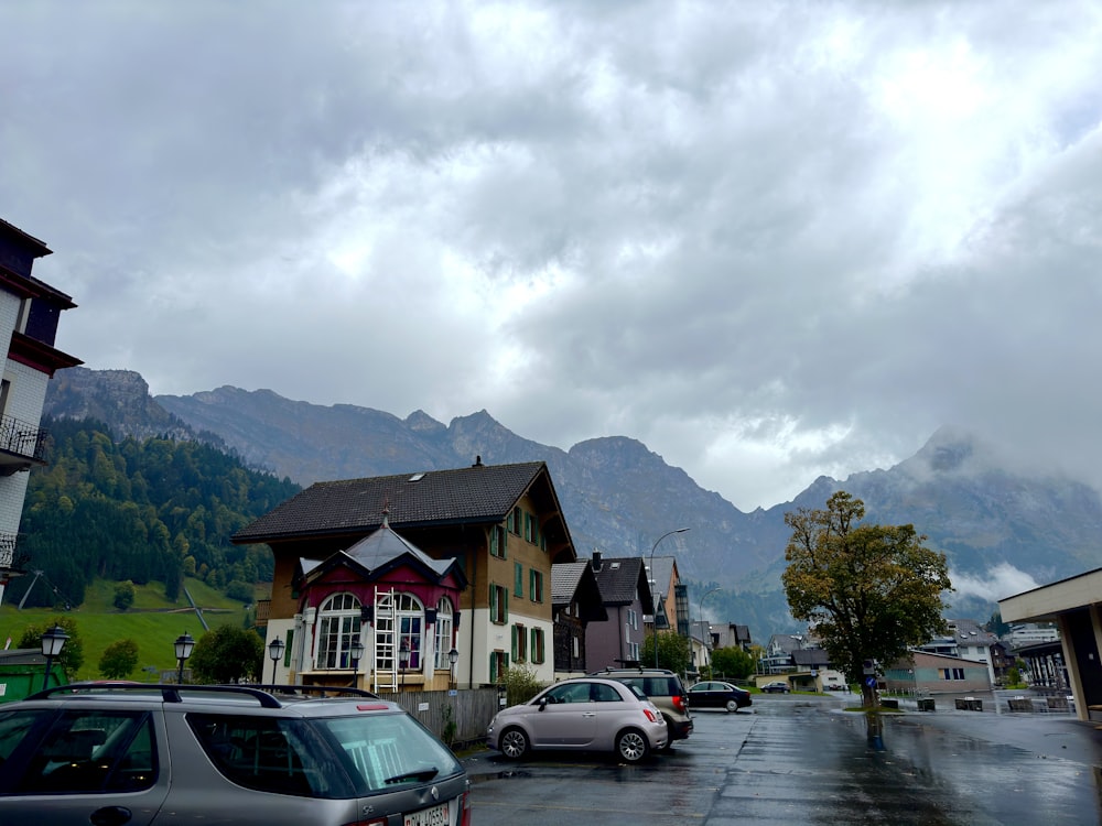 a city street with cars parked on the side of the road