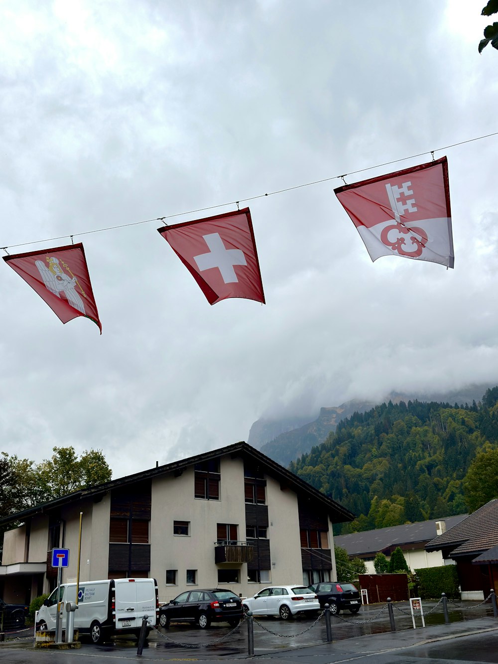 a group of red and white flags hanging from a line