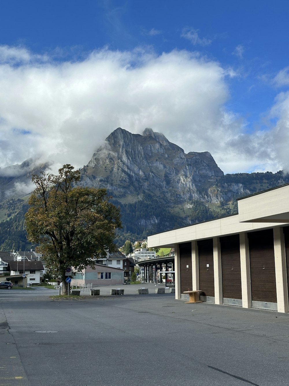 a parking lot with a mountain in the background