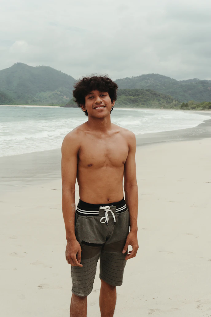 Men in colorful shorts at the beach