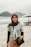 a woman standing on top of a sandy beach