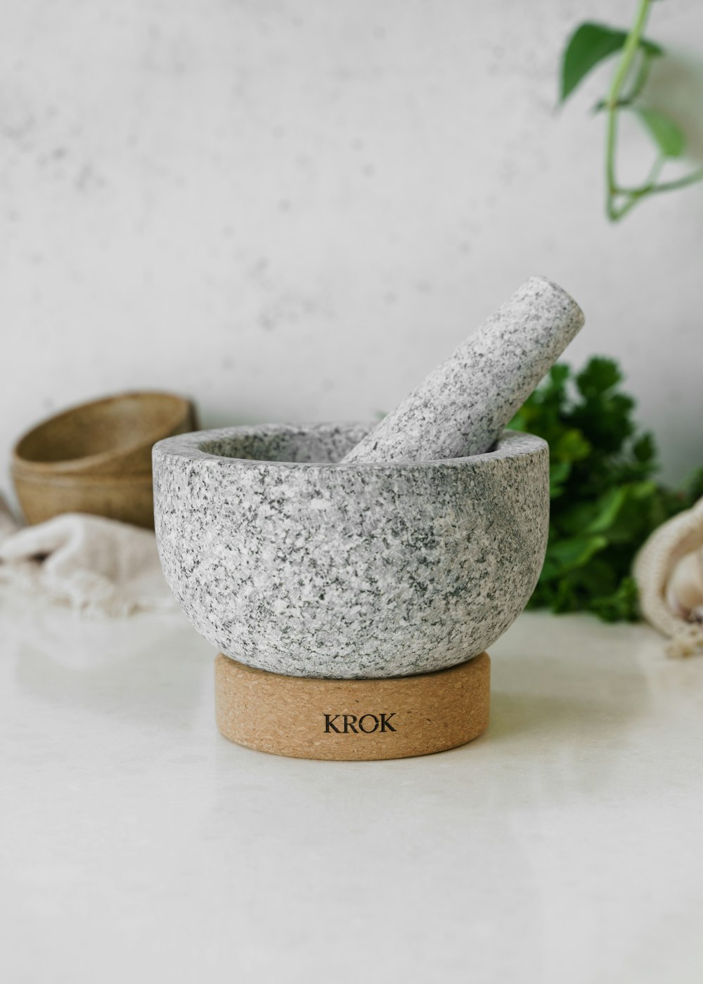a mortar and pestle set on a counter