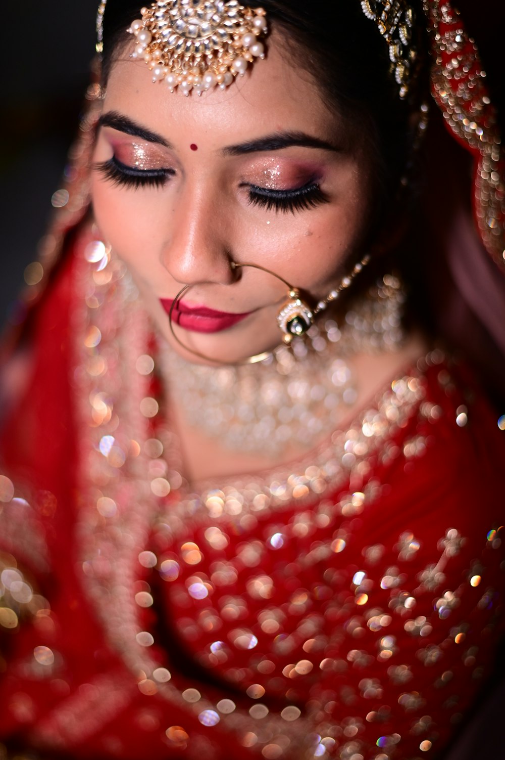 a woman wearing a red and gold outfit