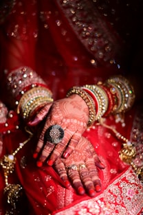 a close up of a woman's hands with hennap