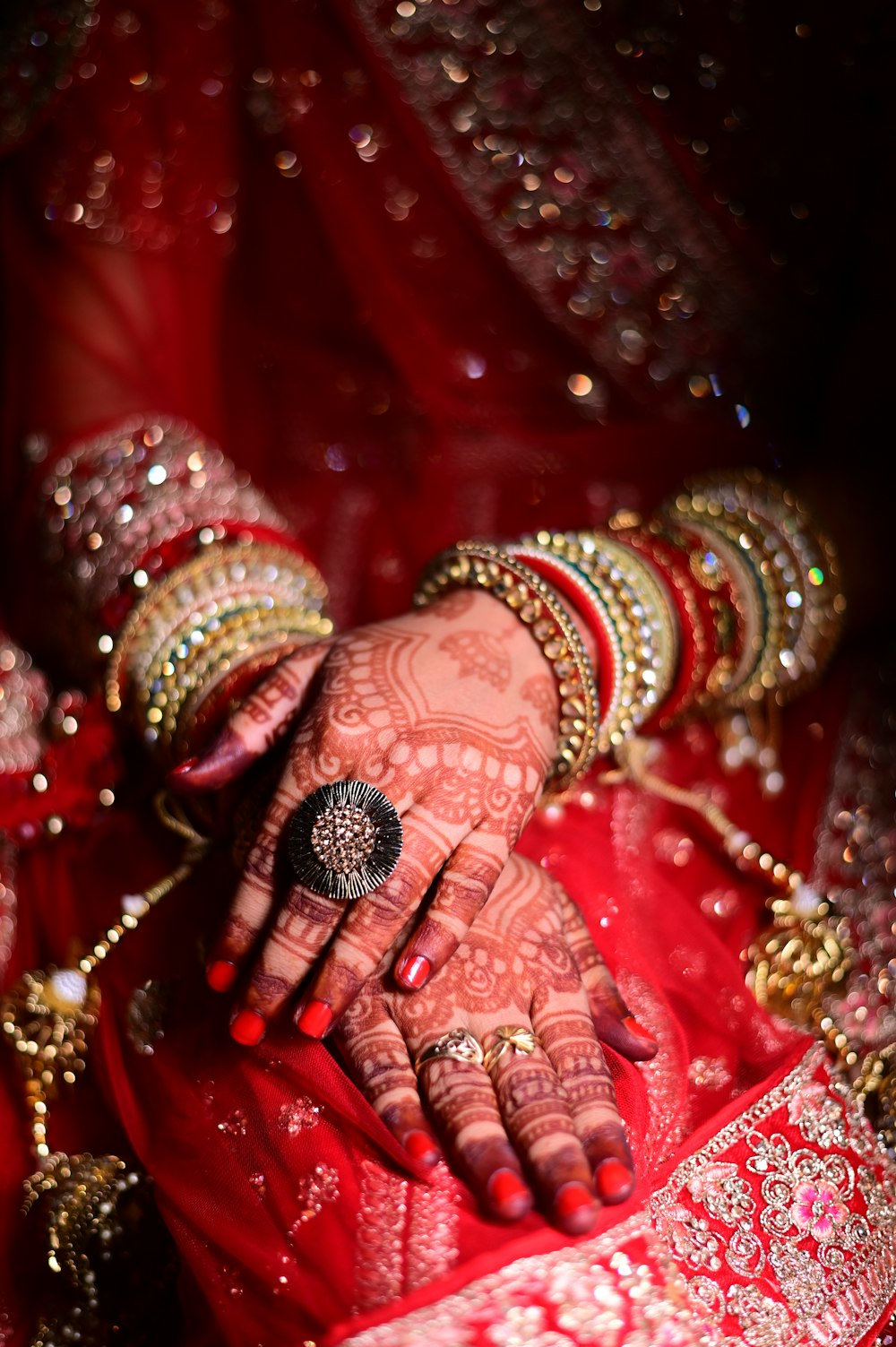a close up of a woman's hands with hennap