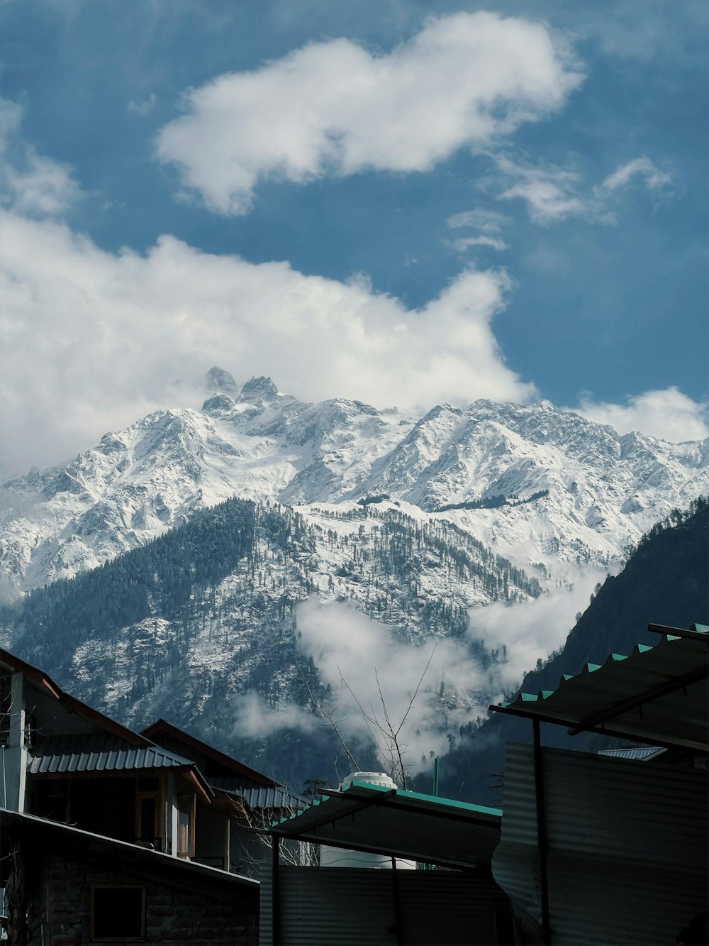 a snow covered mountain range in the distance