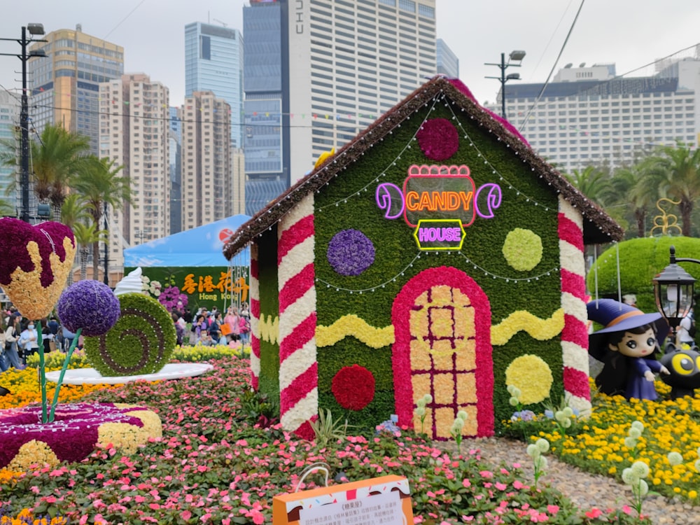 a house made out of flowers in a garden