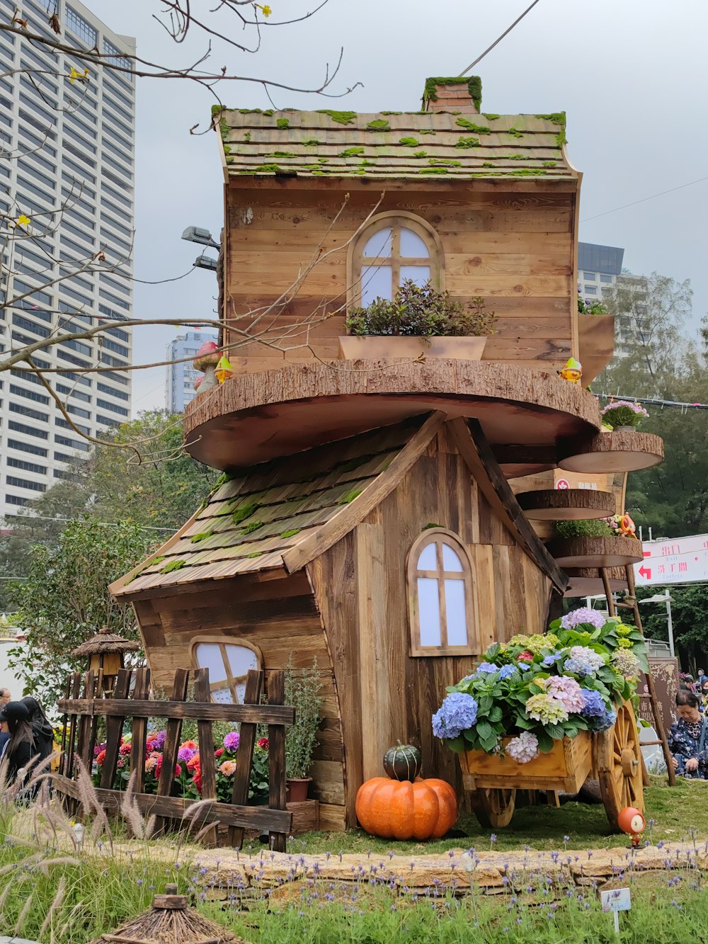 a house made out of wood and plants