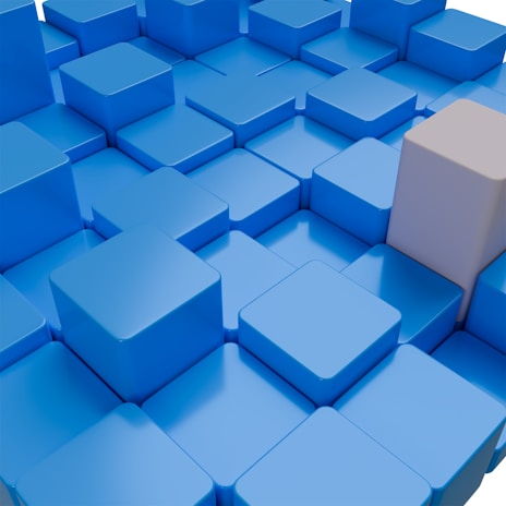 a bunch of blue and white squares with a white cube in the middle