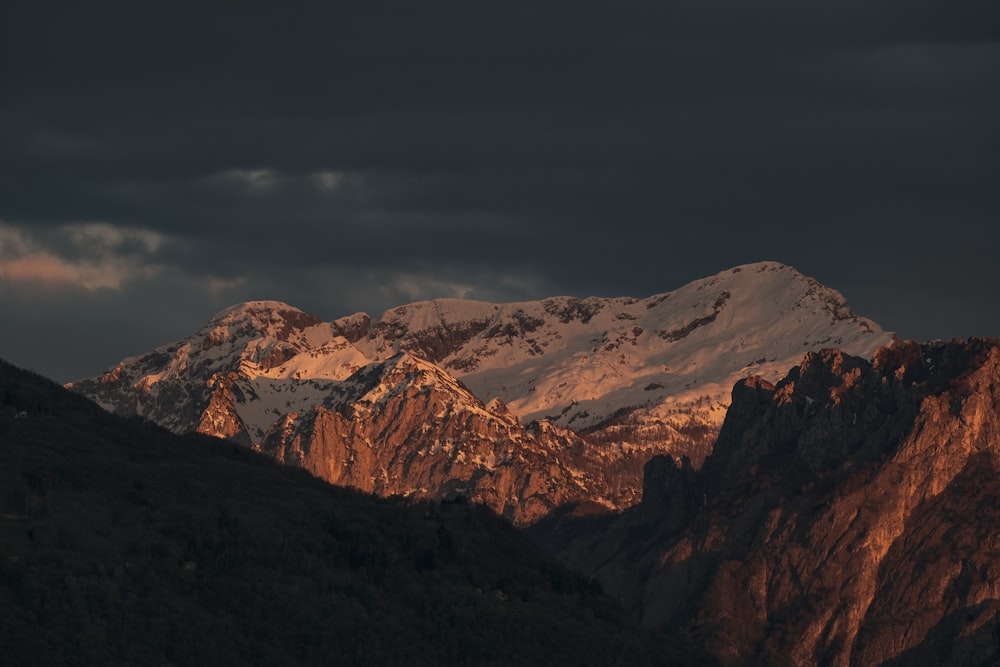 a view of a mountain range at sunset