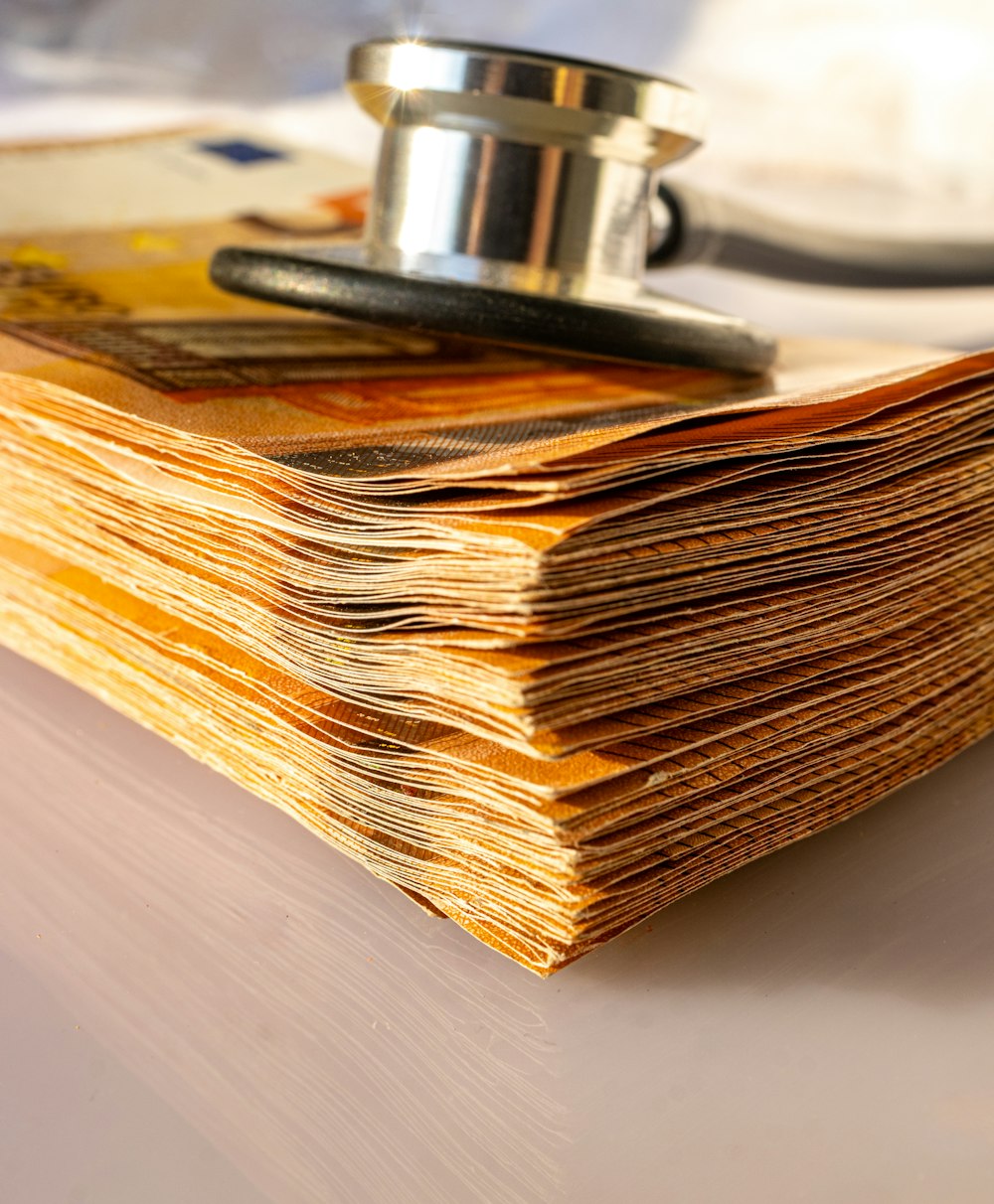 a stack of paper with a stethoscope on top of it