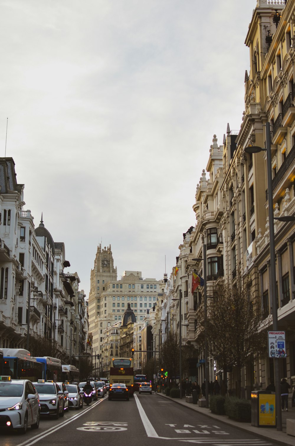 a city street filled with lots of tall buildings