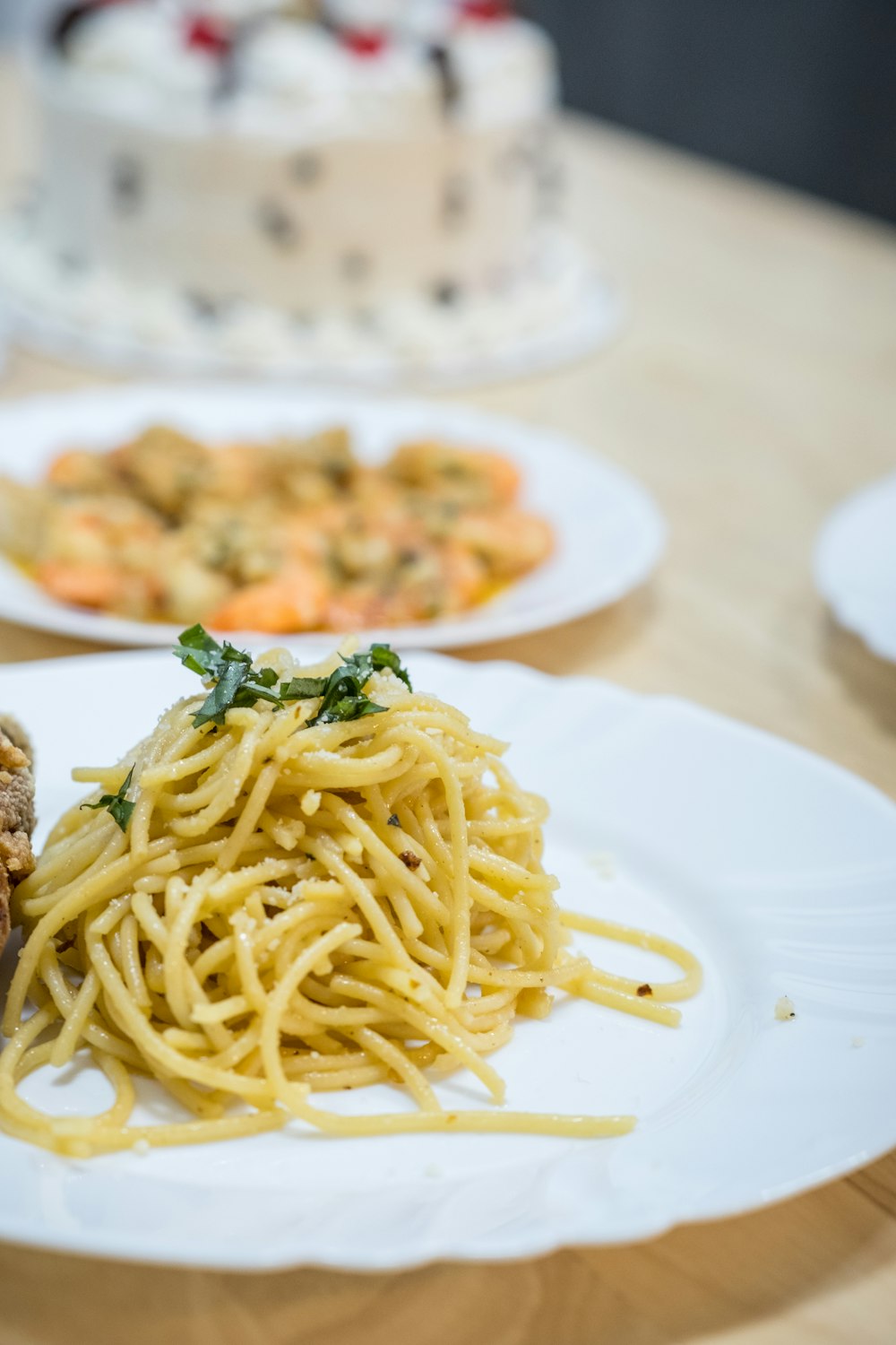 a white plate topped with spaghetti and meat