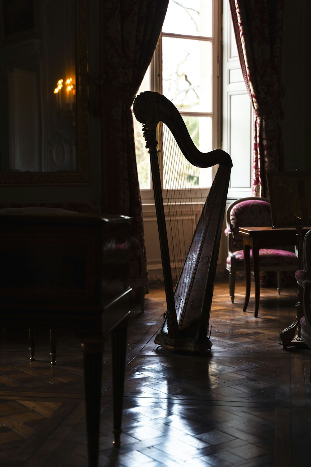 a harp sitting in a room next to a window