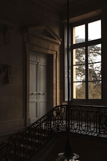 a balcony with a light hanging from it's side