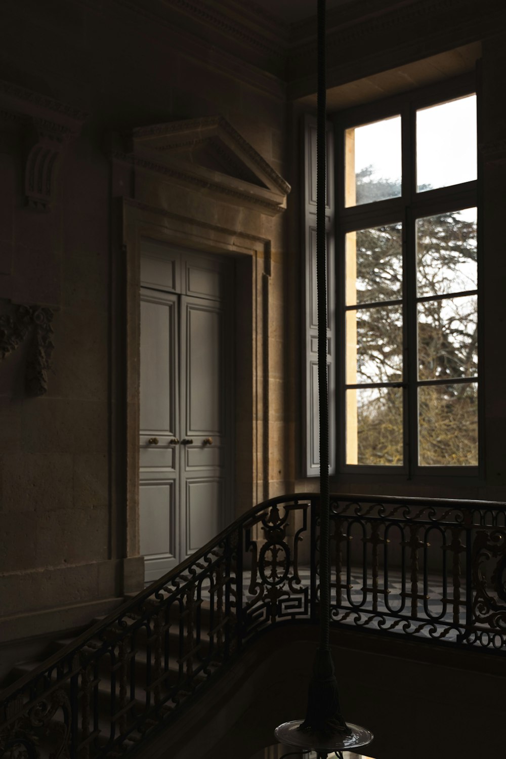 a balcony with a light hanging from it's side