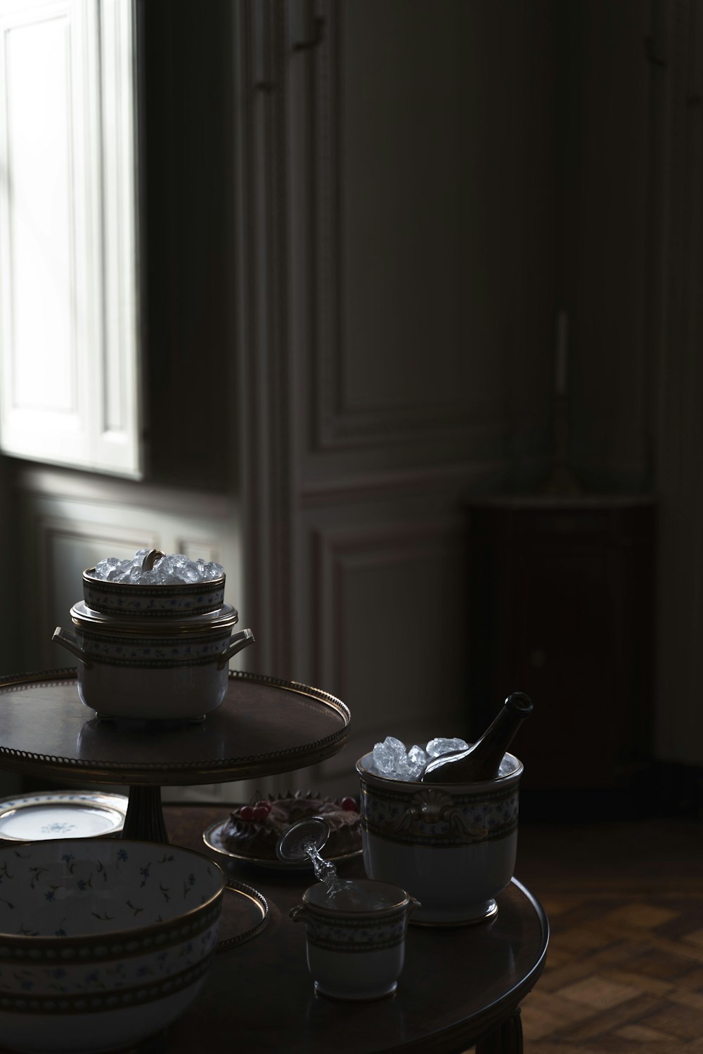 a table topped with plates and bowls of food