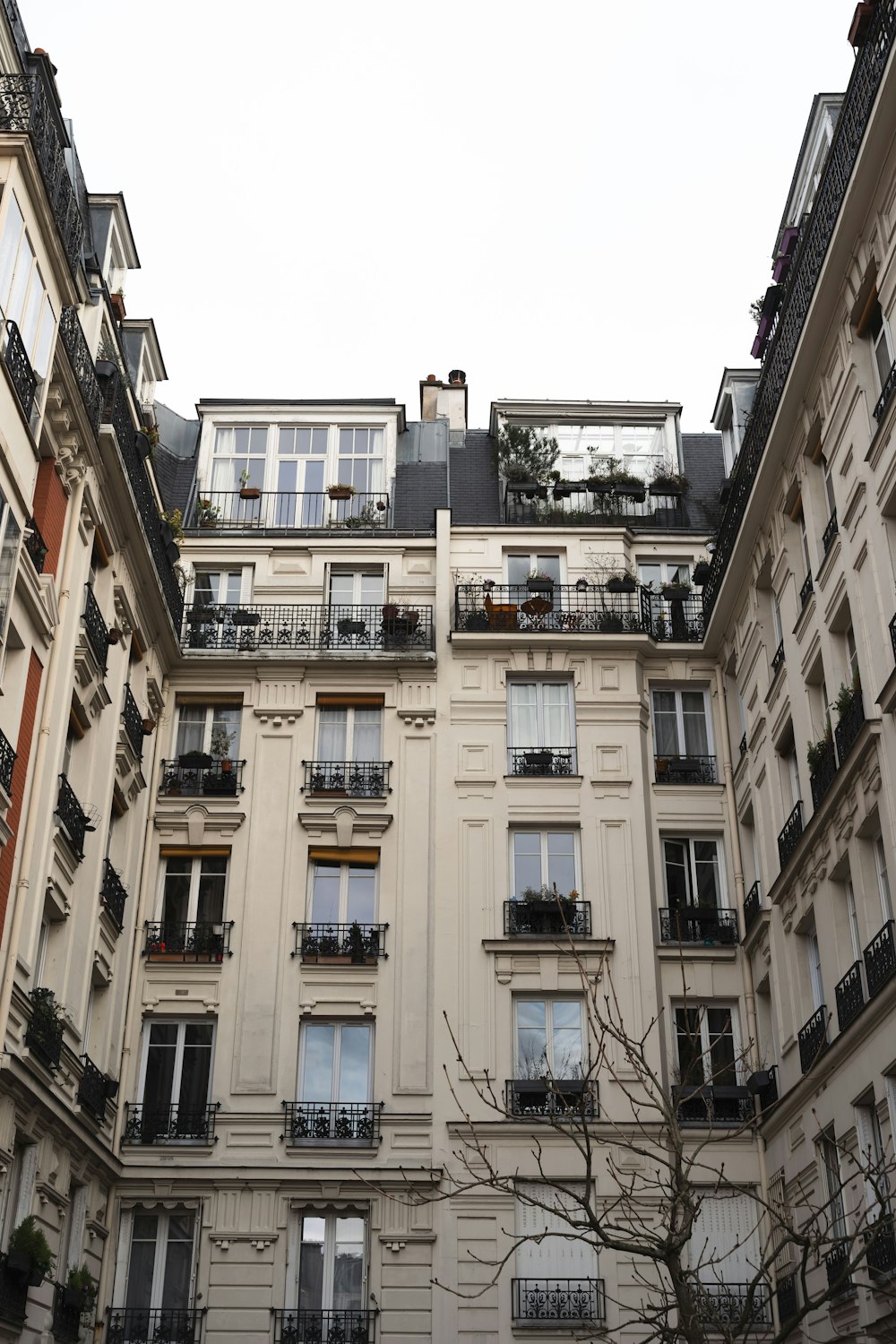 an apartment building with balconies and balconies on the windows