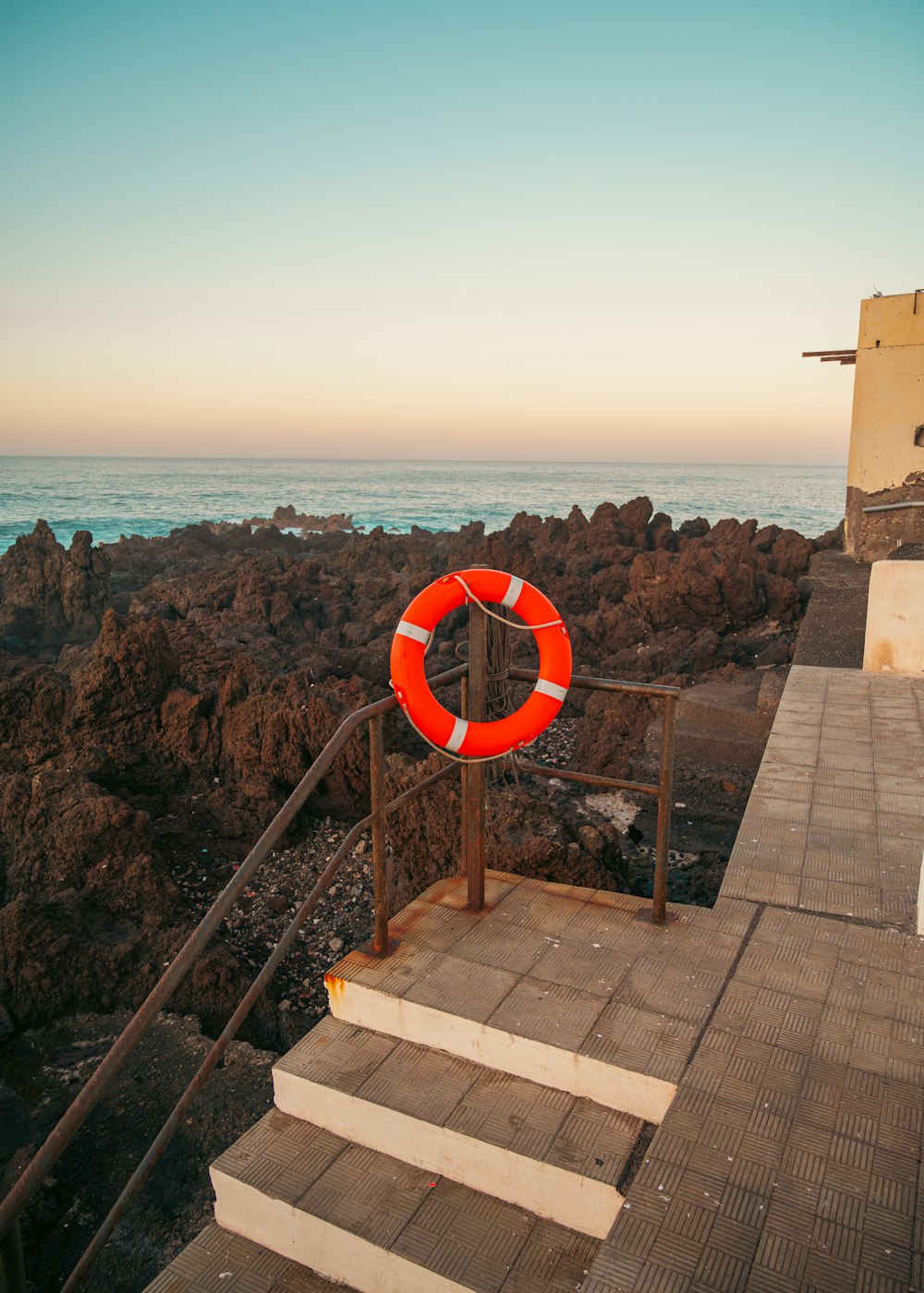 a life preserver sitting on top of a set of stairs