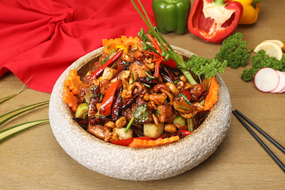 a bowl of stir fried vegetables on a table