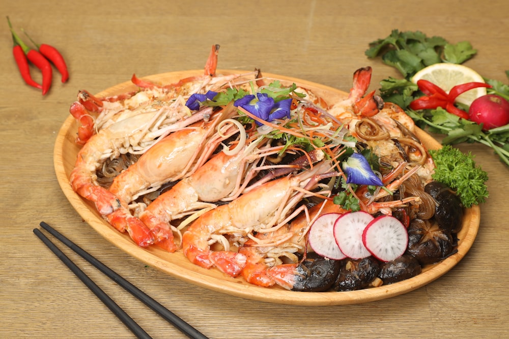 a plate of food with chopsticks on a table