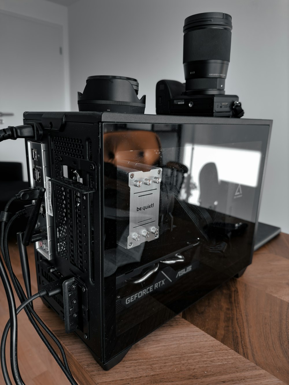 a black computer case sitting on top of a wooden table