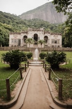 a large white building with a fountain in front of it