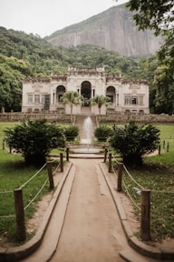 a large white building with a fountain in front of it