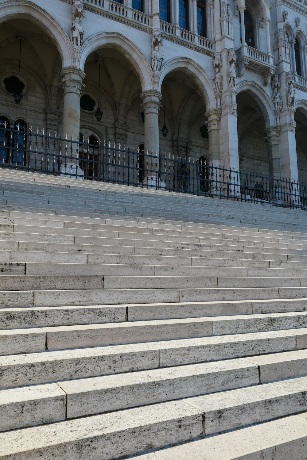 a man riding a skateboard down the side of a set of stairs