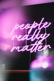 a neon sign that says people really matter
