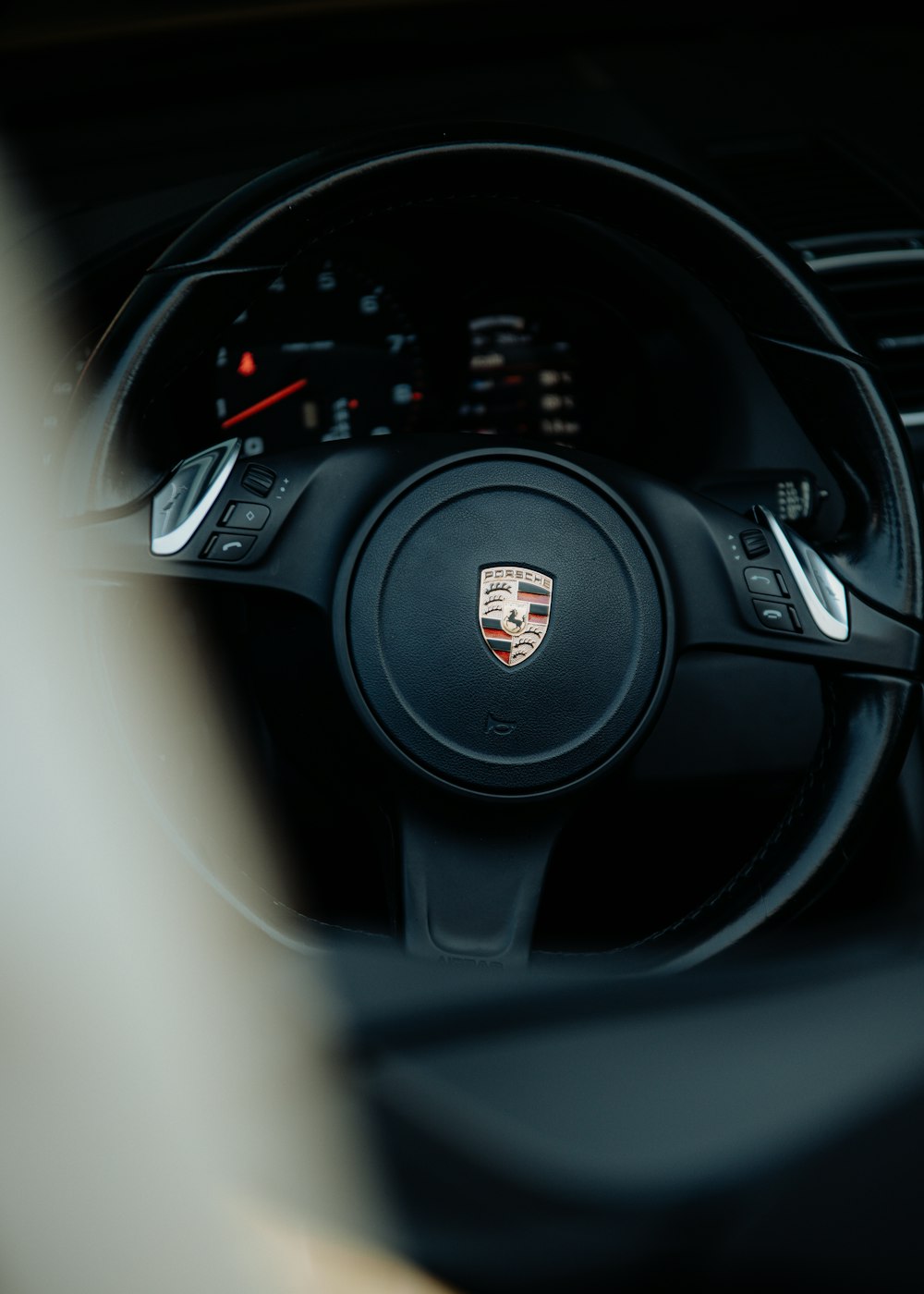 a close up of a steering wheel in a car