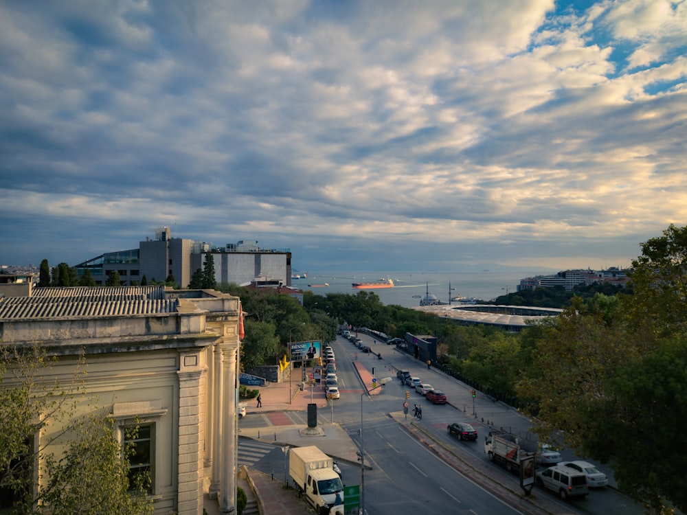 a view of a city street with a cloudy sky