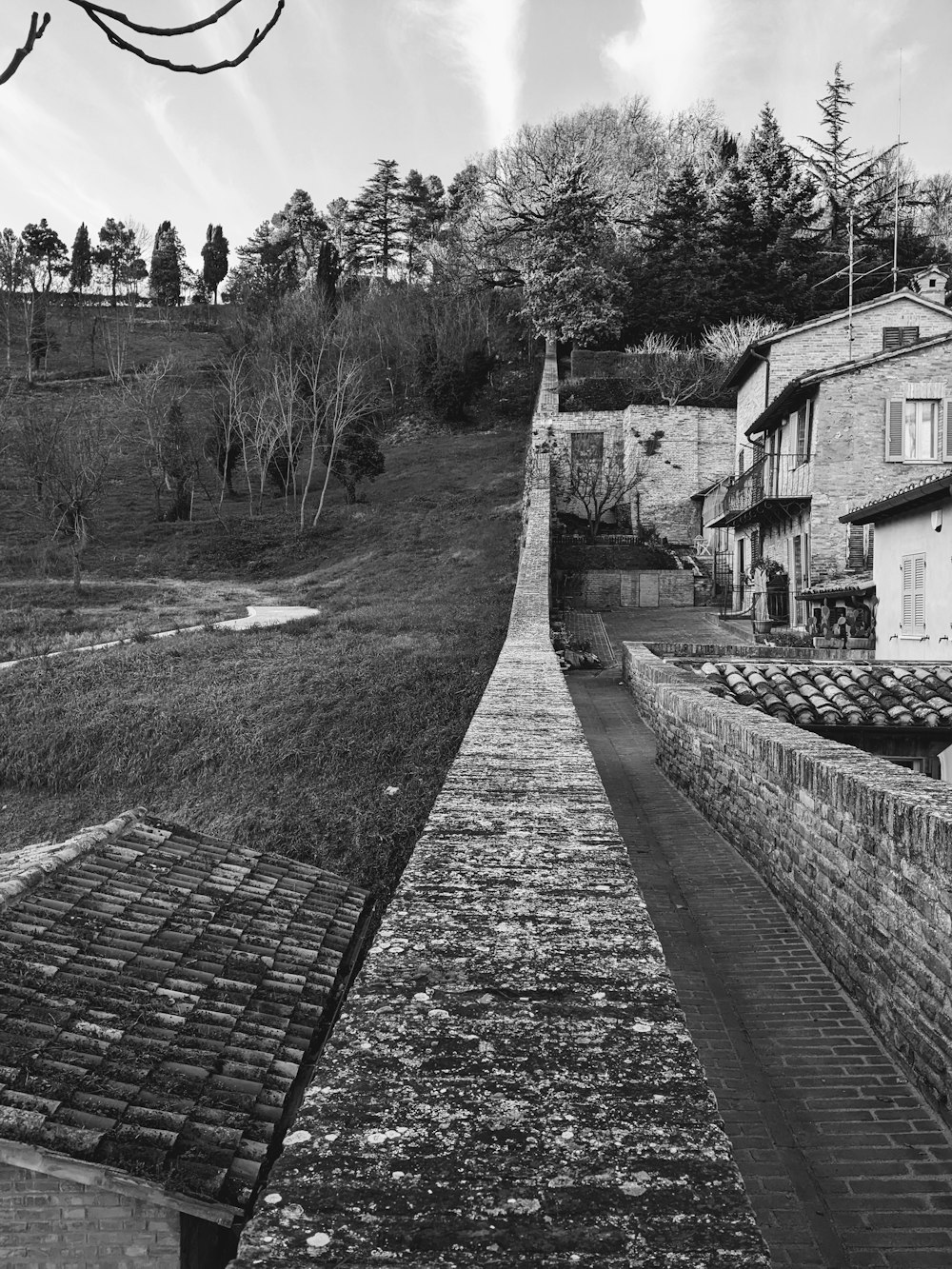 a black and white photo of a stone wall