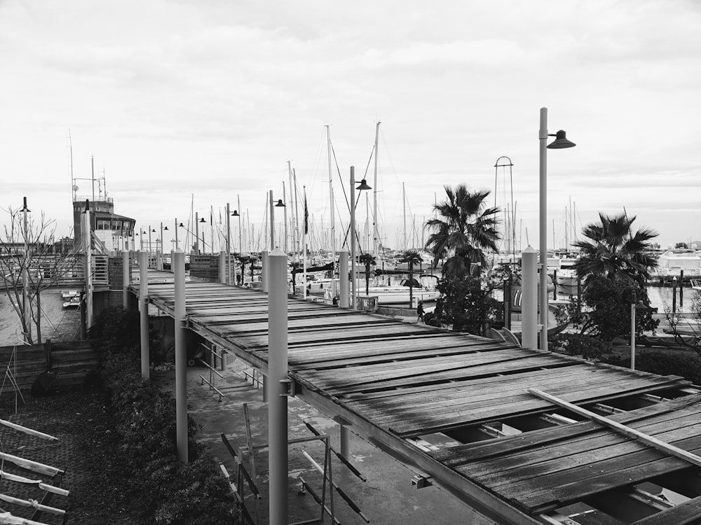 a black and white photo of a boat dock