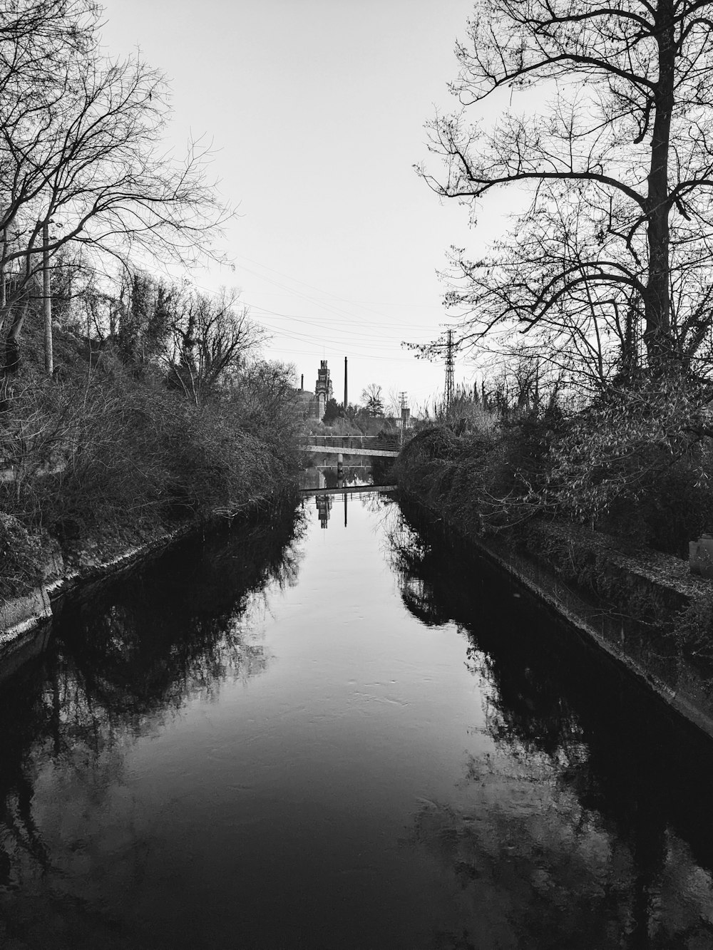 a black and white photo of a river