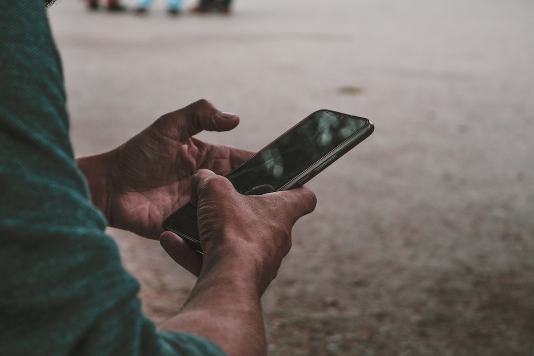 A person holding a phone in both hands
