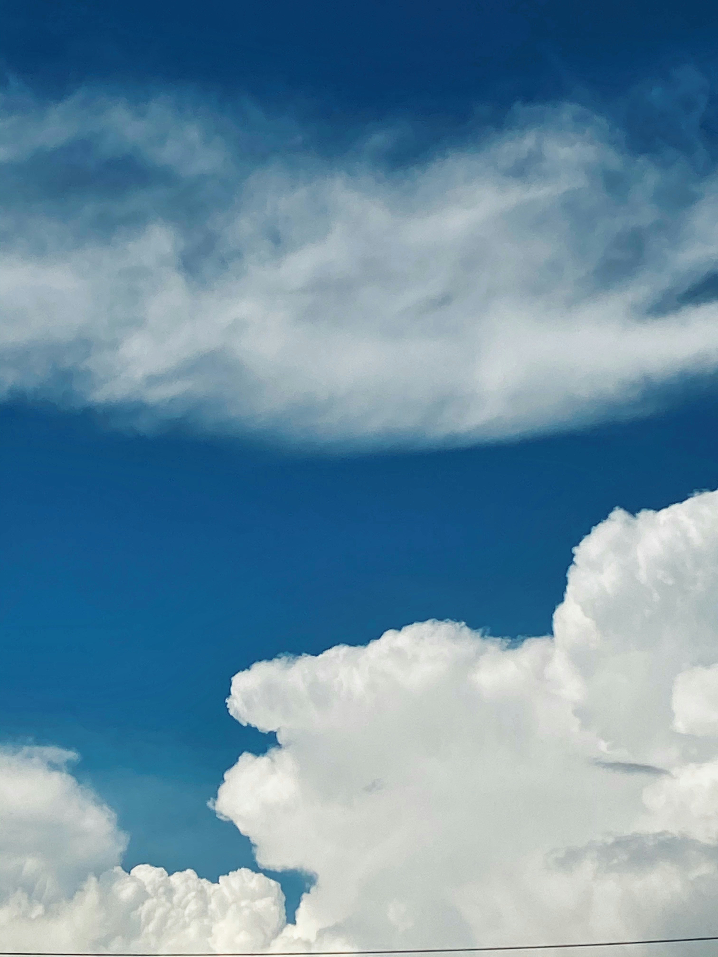 a plane is flying high in the sky