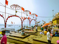 a group of people standing on top of a pier