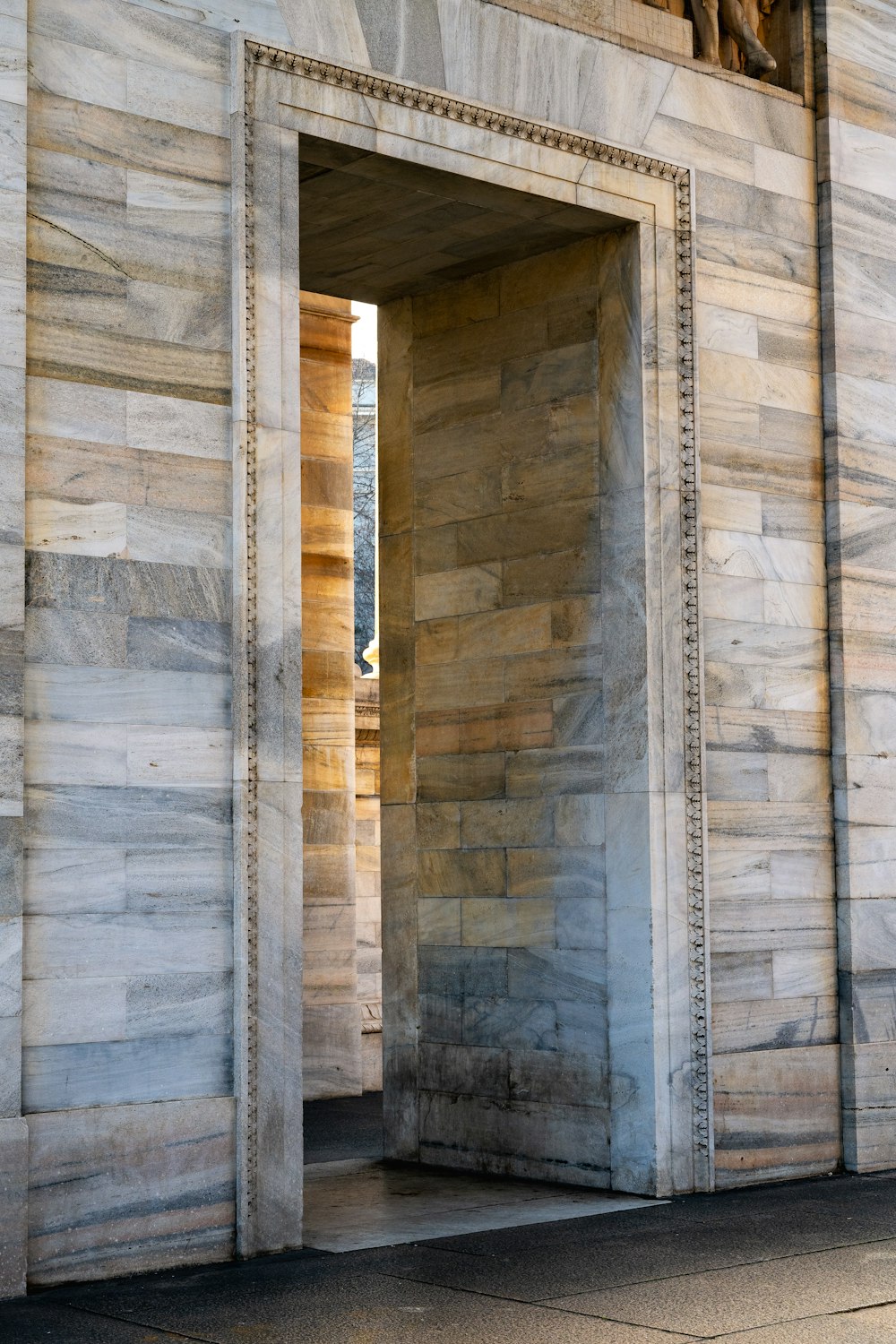 an open door to a building with a clock on it