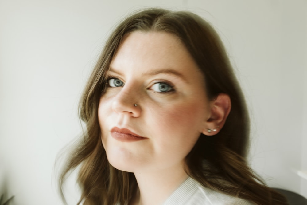 a close up of a woman with blue eyes