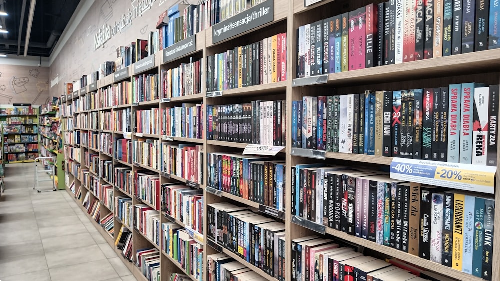 a bookshelf filled with lots of books in a store