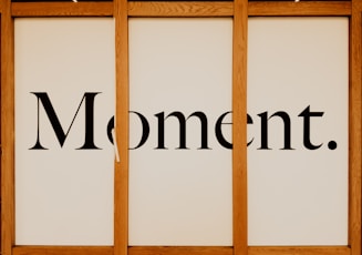 a picture of a sign that says moment