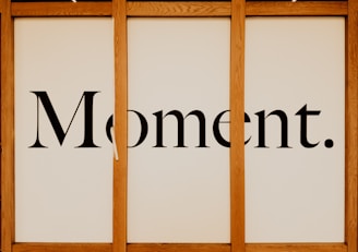 a picture of a sign that says moment