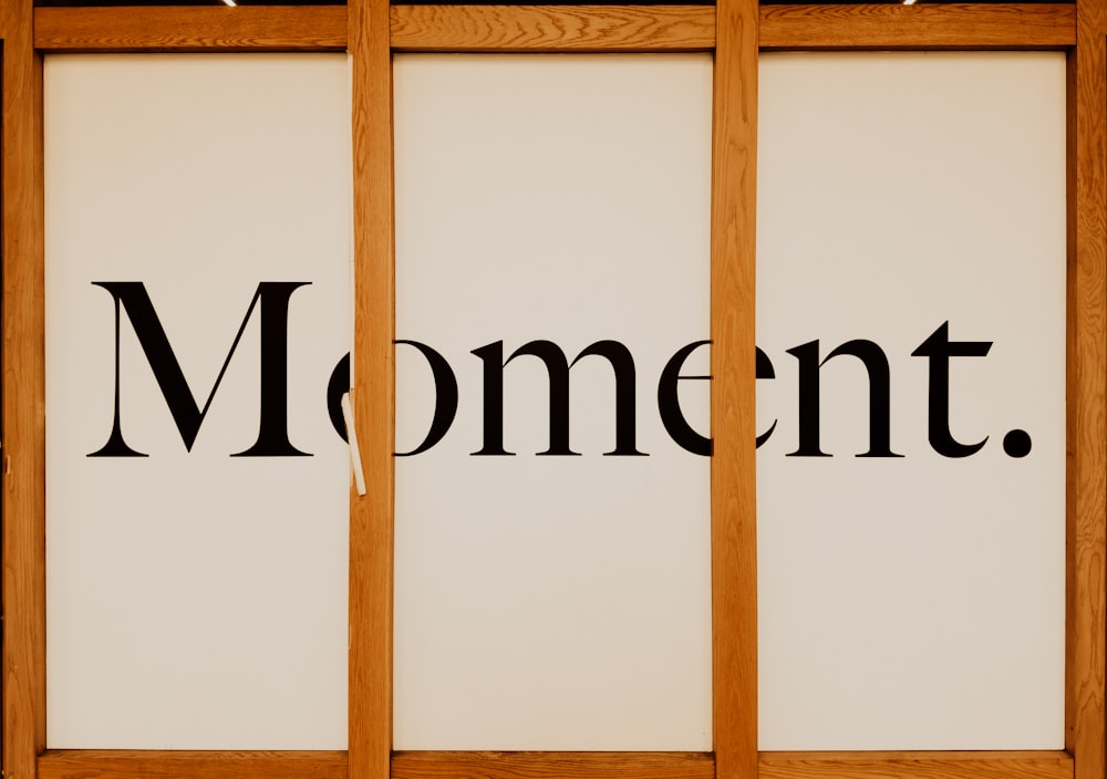 a picture of a sign that says moment