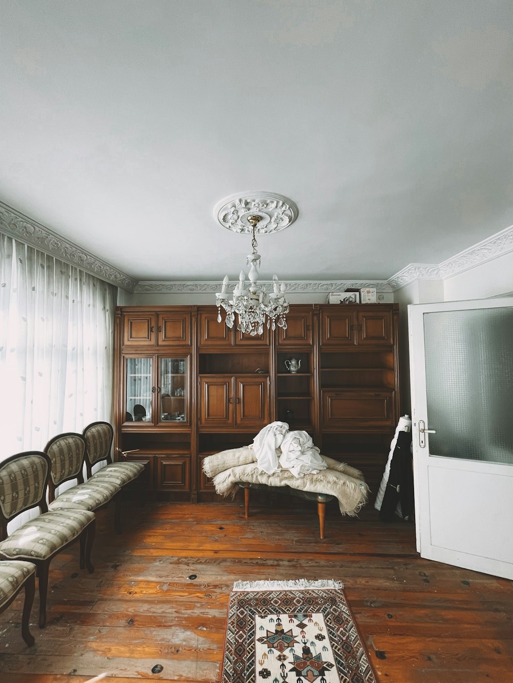 a living room with a chandelier and a couch