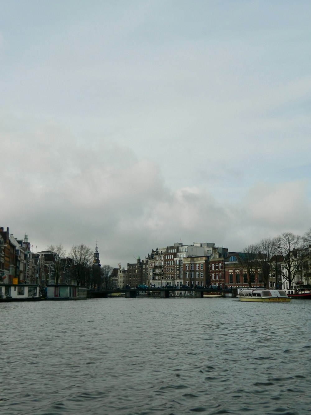 a body of water with buildings in the background